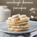 A pinterest image of a stack of pancakes on a blue plate. The text on the image reads "vegan sourdough banana pancakes"