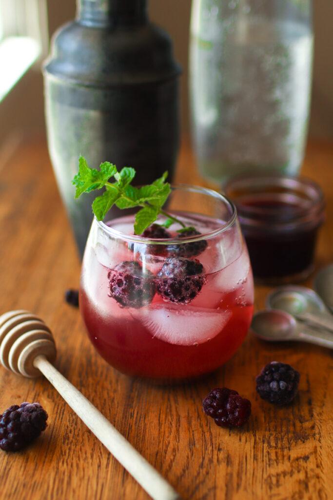 A blackberry cocktail made with homemade blackberry syrup