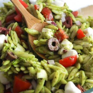 a closeup of pesto orzo pasta salad