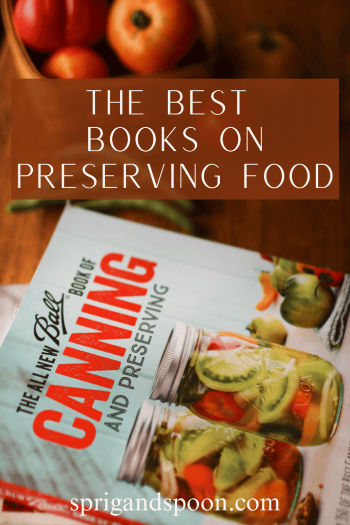 the best book on preserving food with a book and a basket of tomatoes