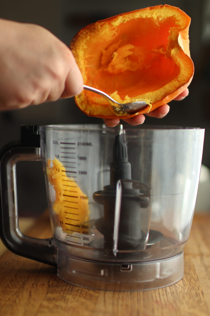 Scooping pumpkin in to a food processor