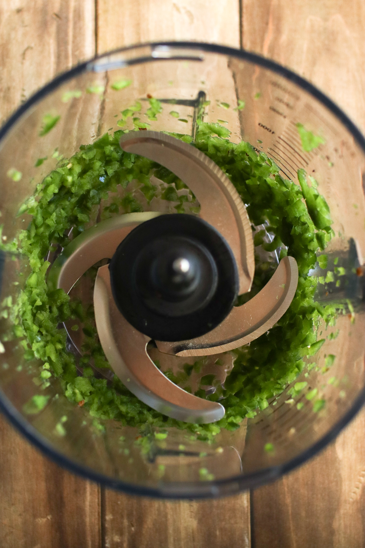 Minced jalapenos in a food processor.