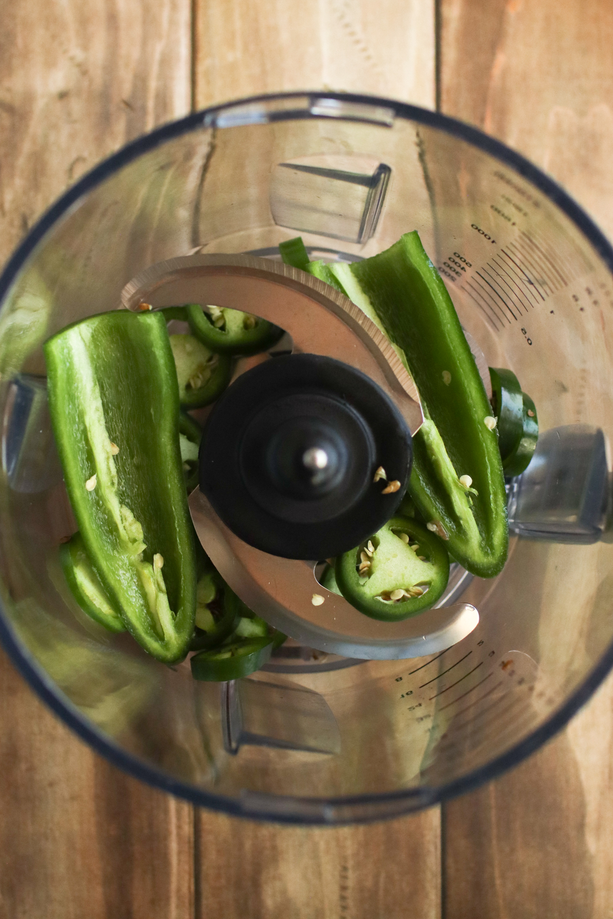 Jalapeno halves in a food processor.