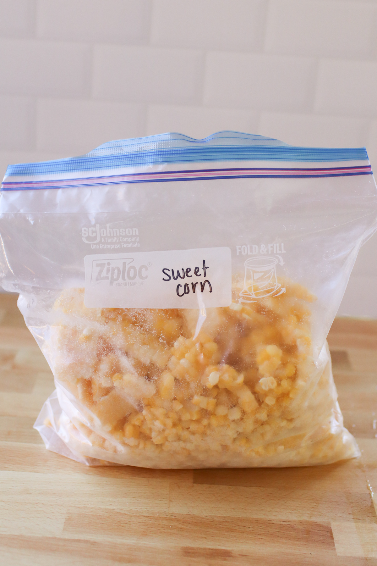 A bag of frozen sweet corn labeled "sweet corn".